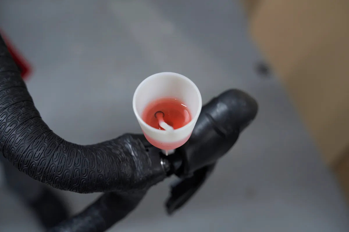 Brake bleed funnel on Shimano shifter with mineral oil