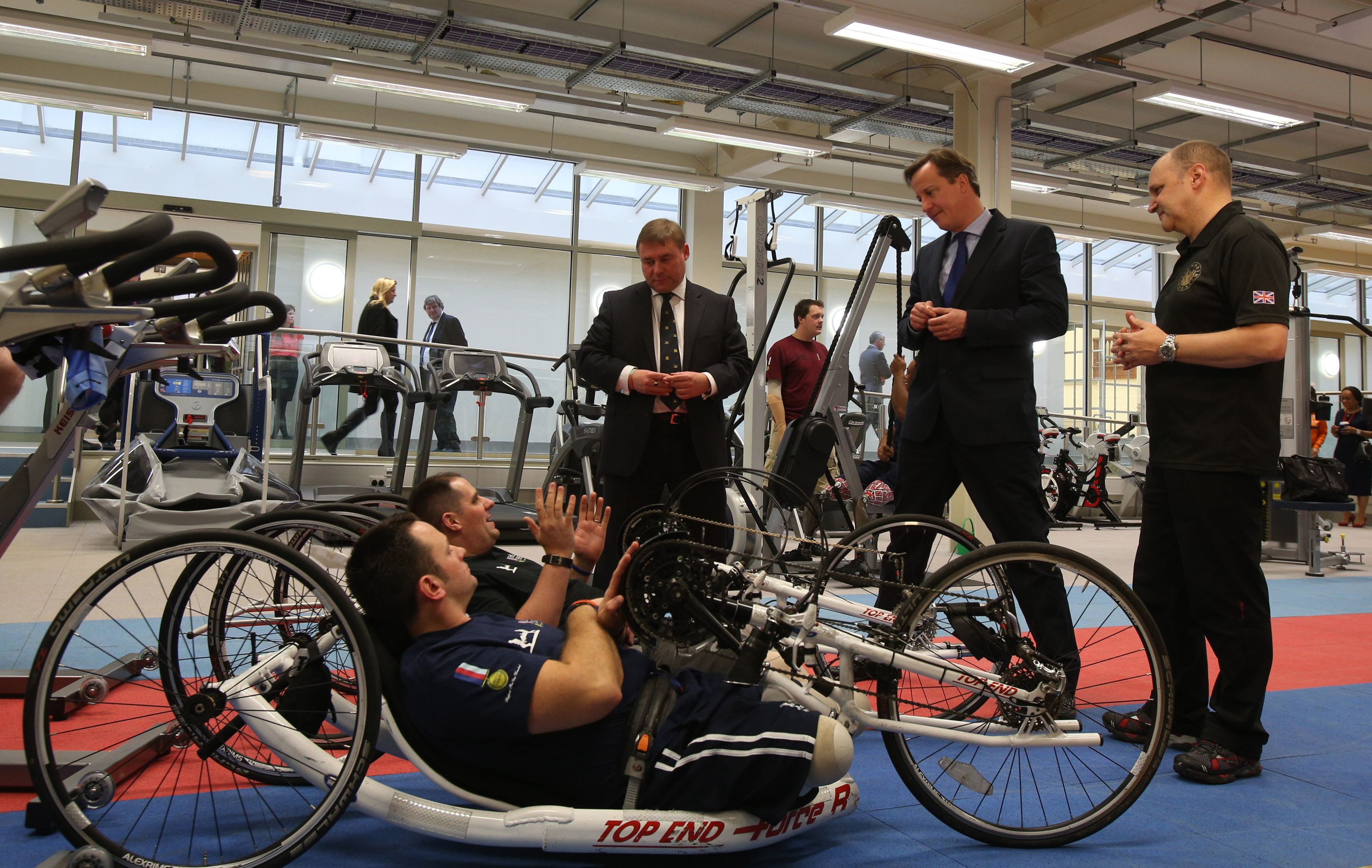 Wounded servicemen Simon Harmer and Steve Arnold with British PM David Cameron