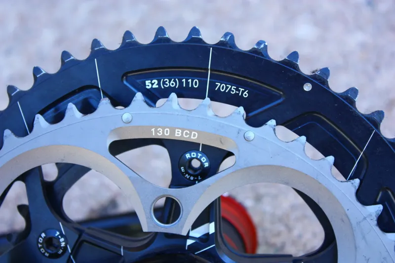 The key number for compatiblilty is BCD (Bolt Circle Diameter) - the diameter of the circle that intersects the center of all five chainring bolts. A compact is 110mm, while a standard is 130mm