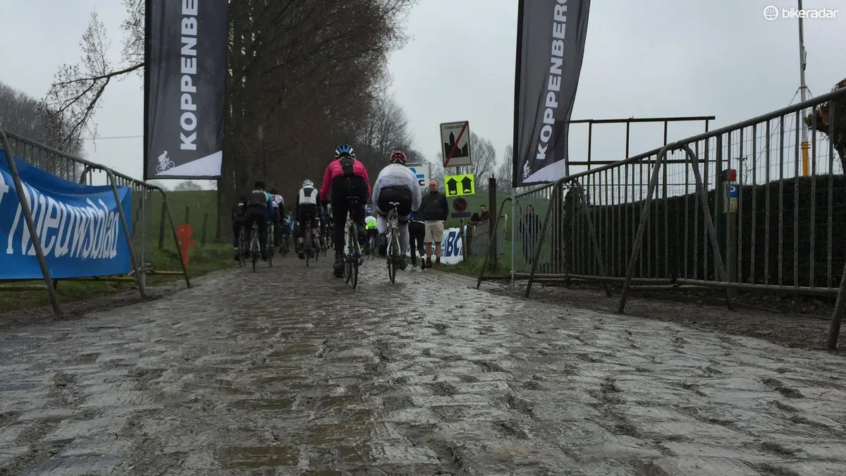 One of the (in)famous climbs of De Ronde, the 600m Koppenberg averages nearly 12 percent, kicking to 22 percent in the middle. And wet cobbles are slick as greased metal