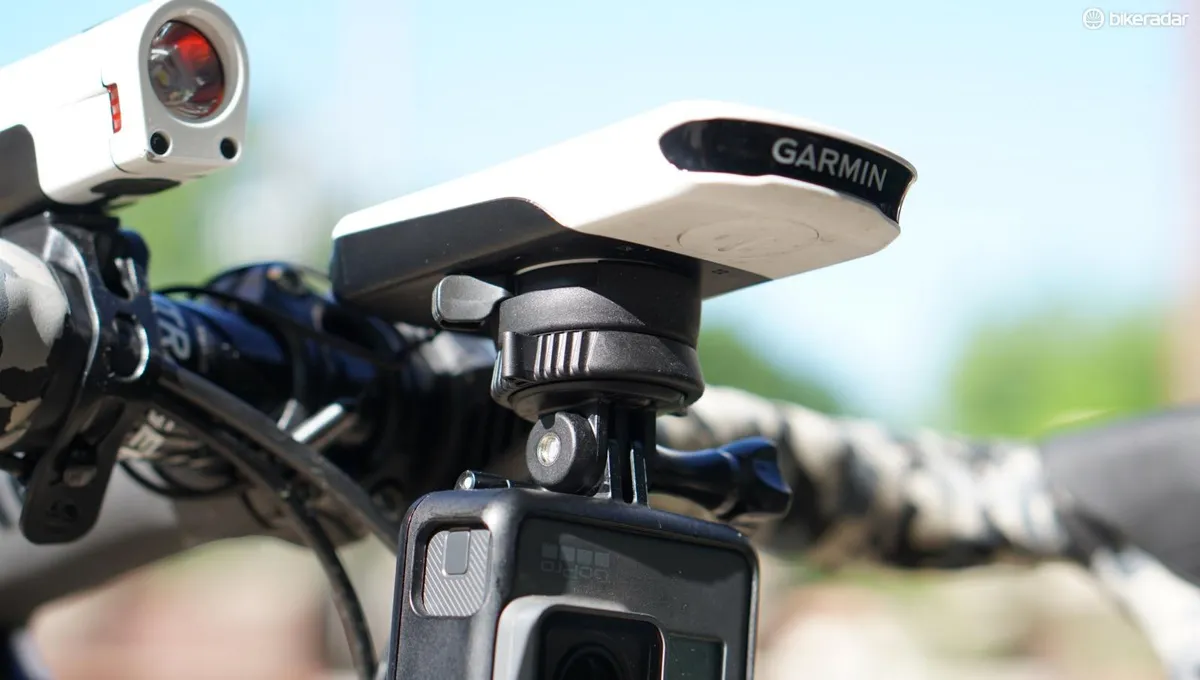 Garmin bike computer with GoPro camera attached underneath.