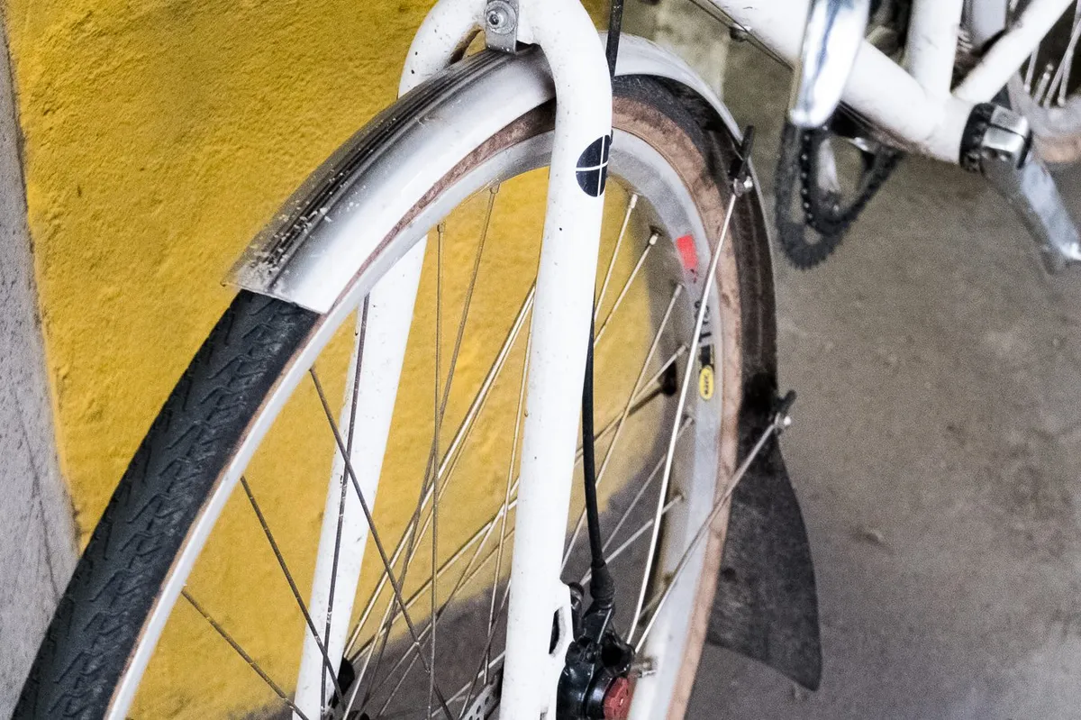 A well used set of SKS Chromoplastic mudguards embellished with a suitably ugly, custom mudflap