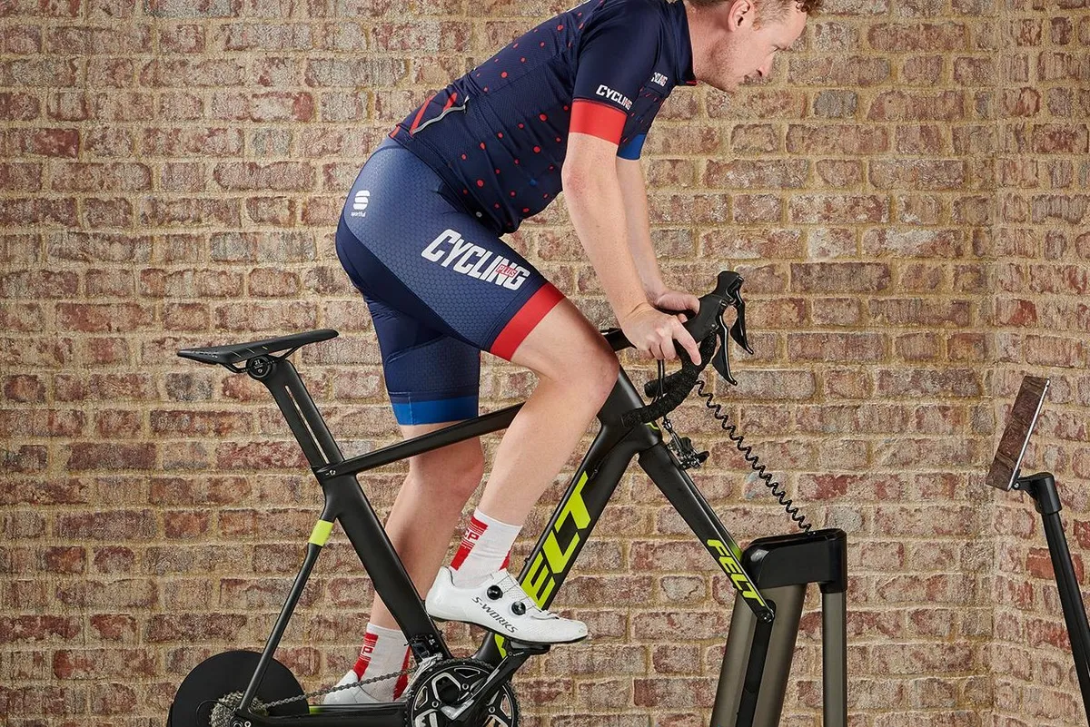 Cyclist using a smart trainer with the Wahoo Kickr Climb