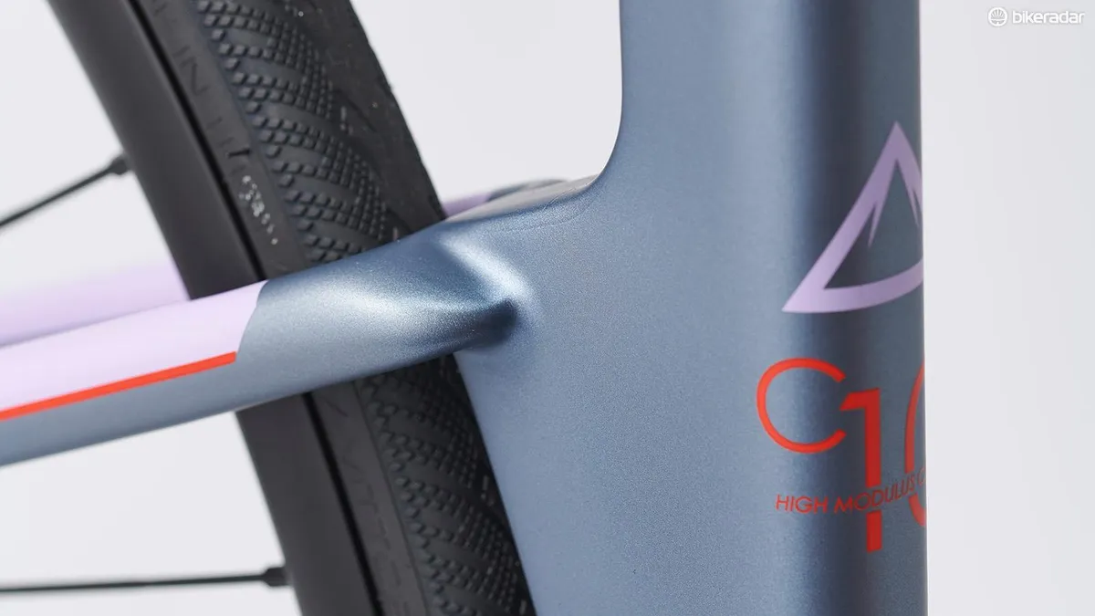 Close-up detail of carbon bicycle frame showing aerodynamic frame shape detail
