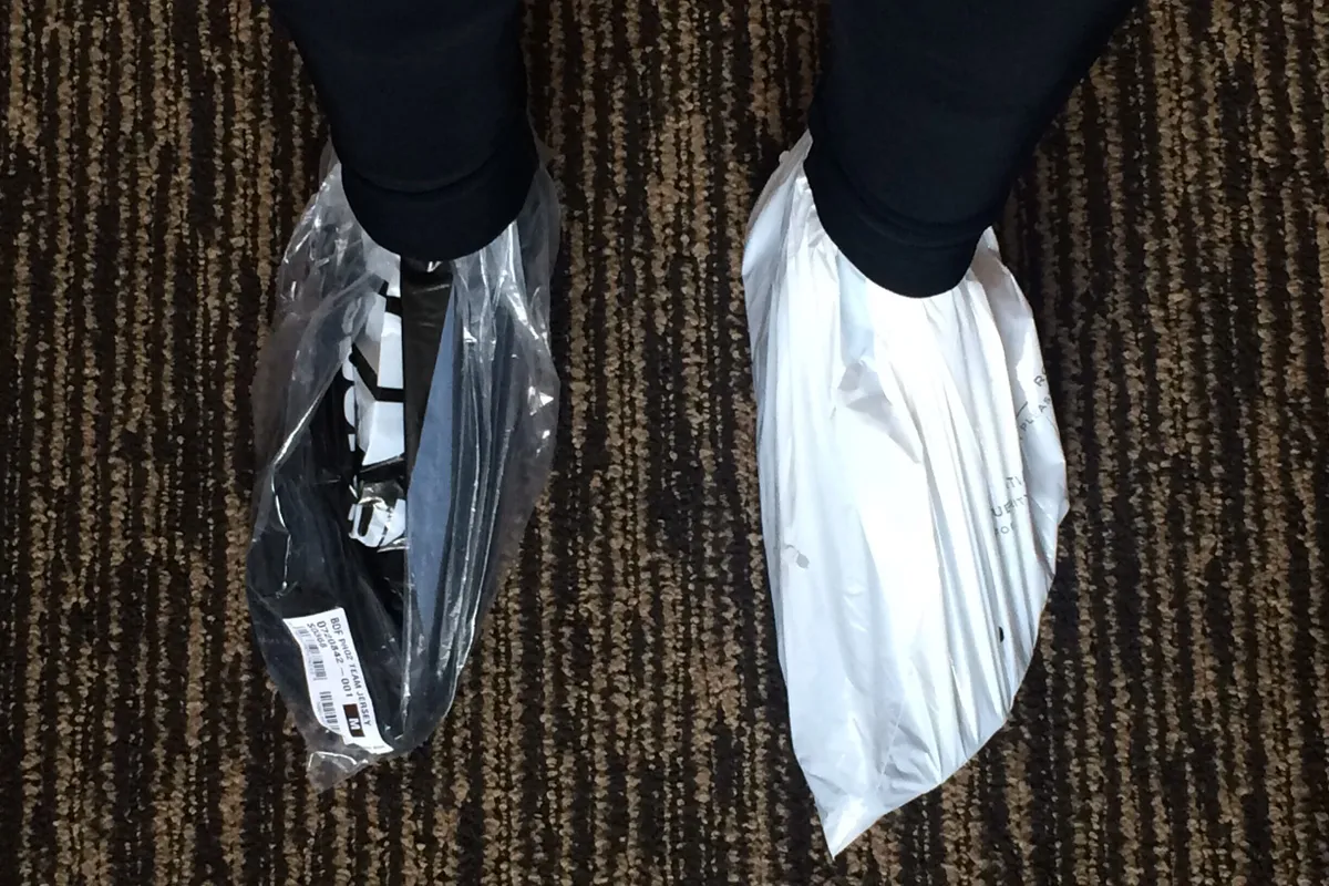 Cyclists feet in plastic bags