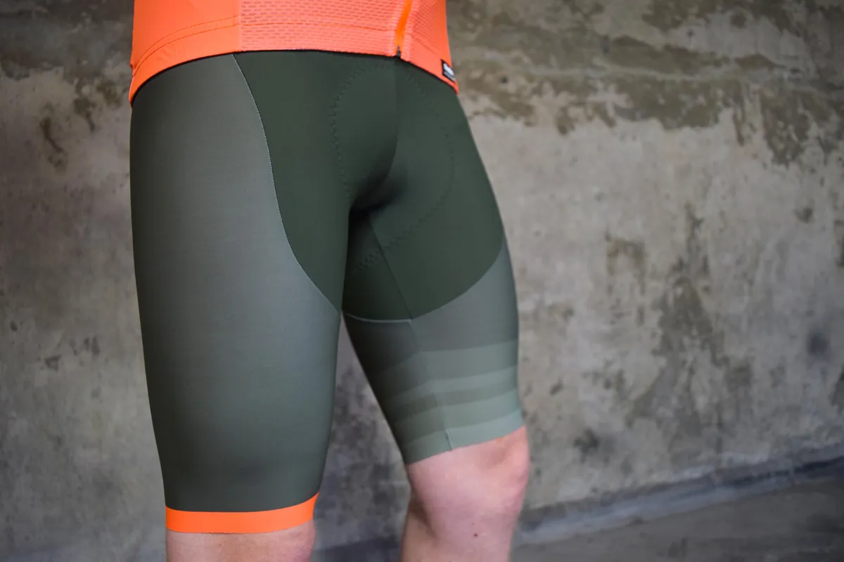 Santini green shorts with ornage highlight on seam worn by a man