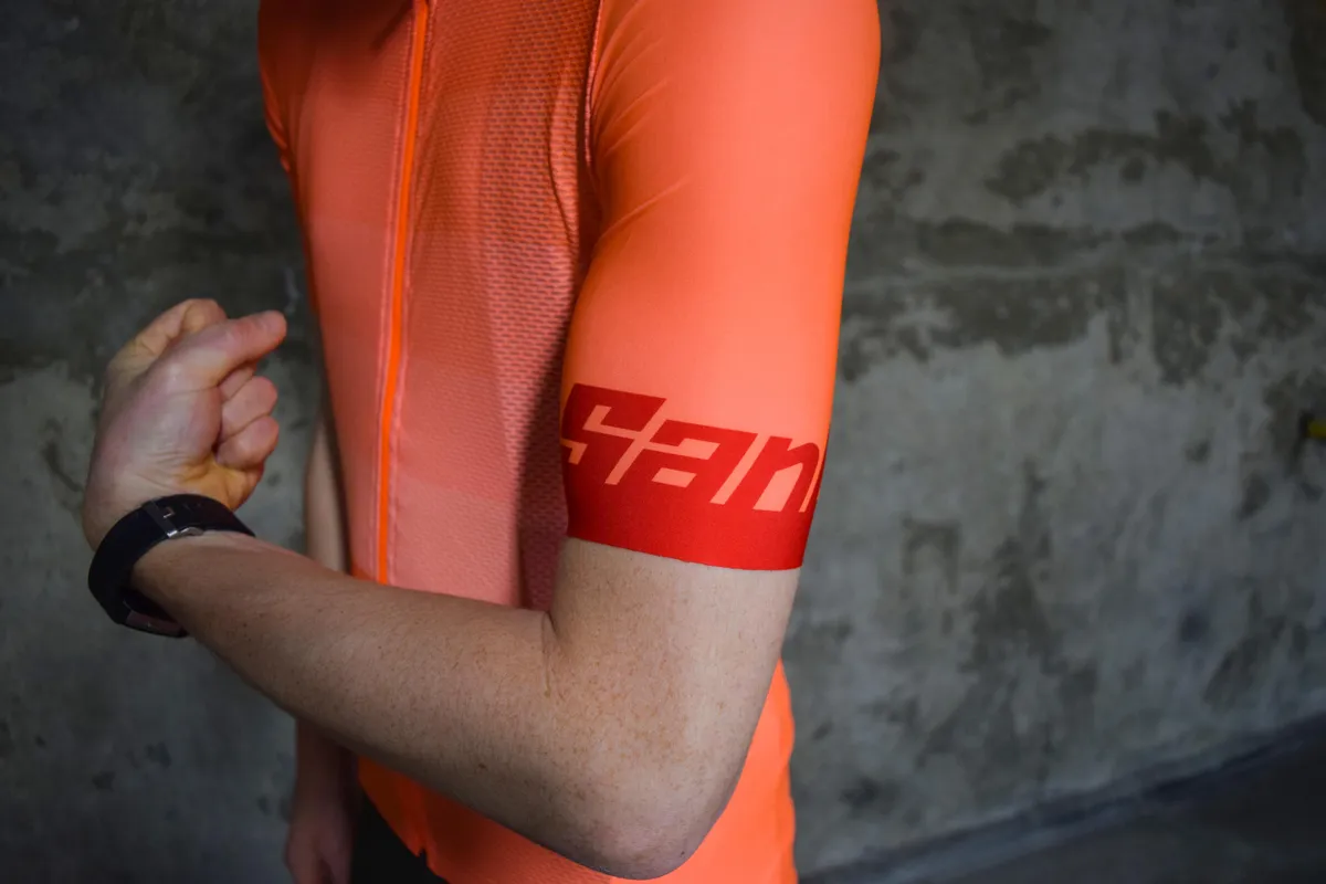 Santini orange-coloured cycling jersey sleeve