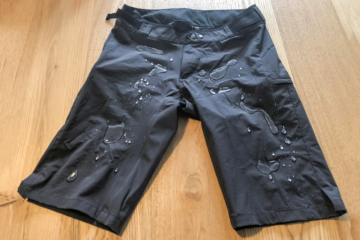 Water beading on the DWR coated Mission Workshop The Traverse shorts