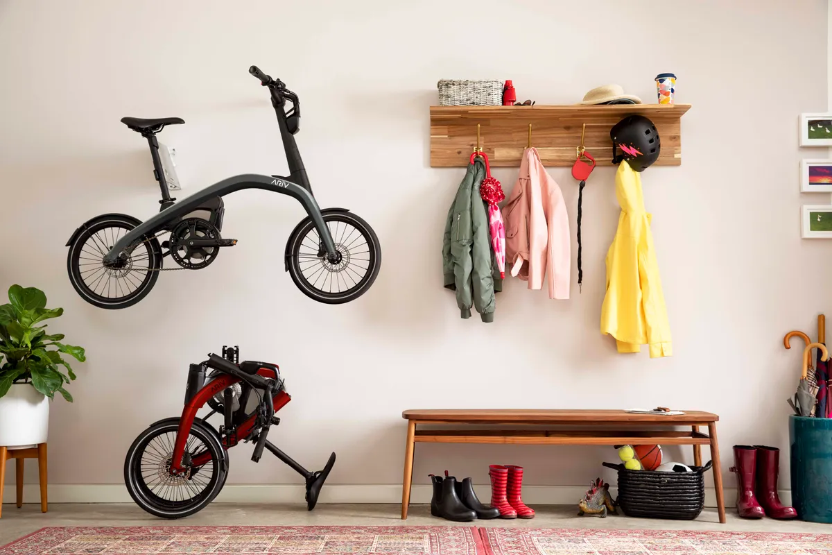 Ariv Merge electric folding bike folded and unfolded in home