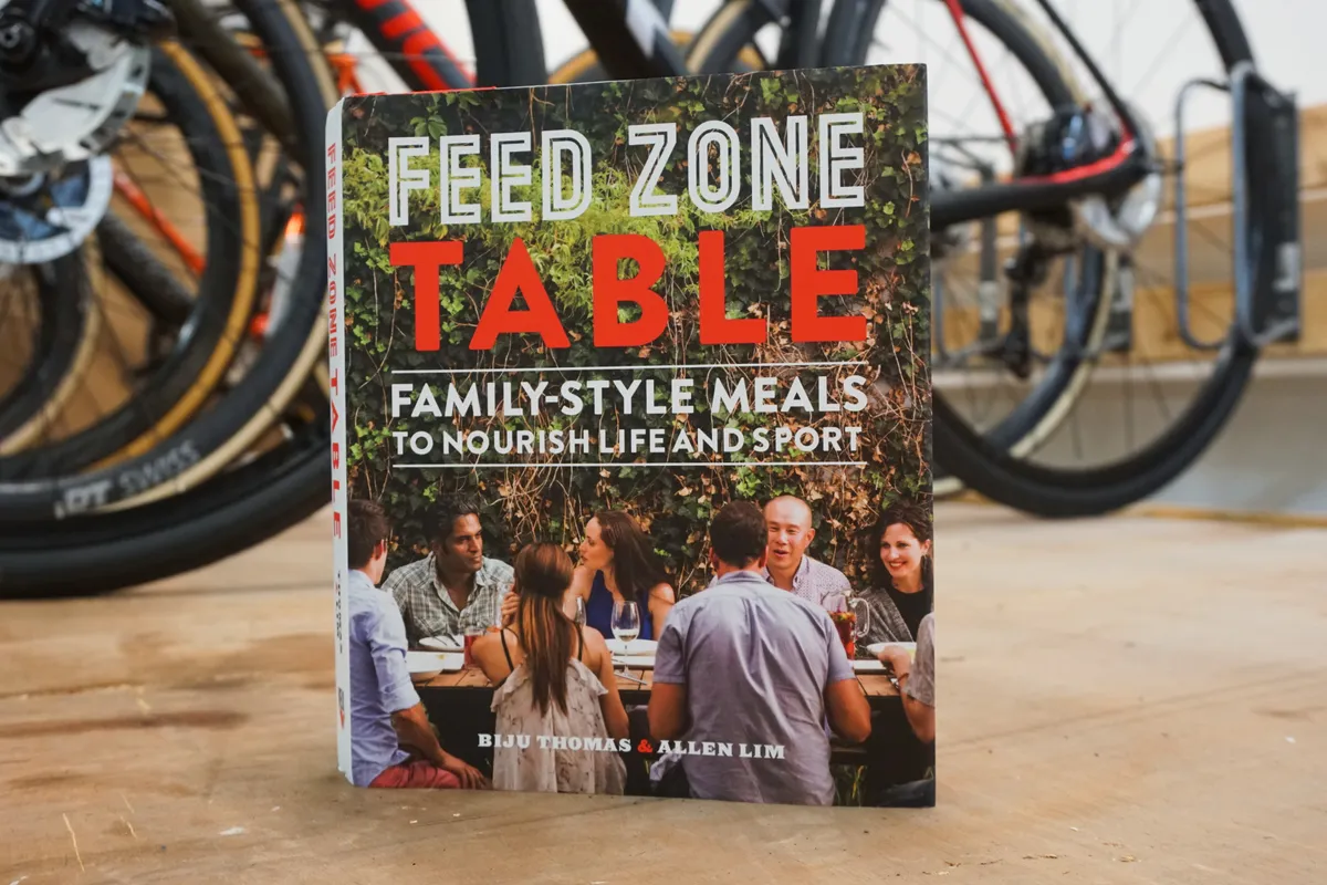 Feed Zone table book with bikes in background