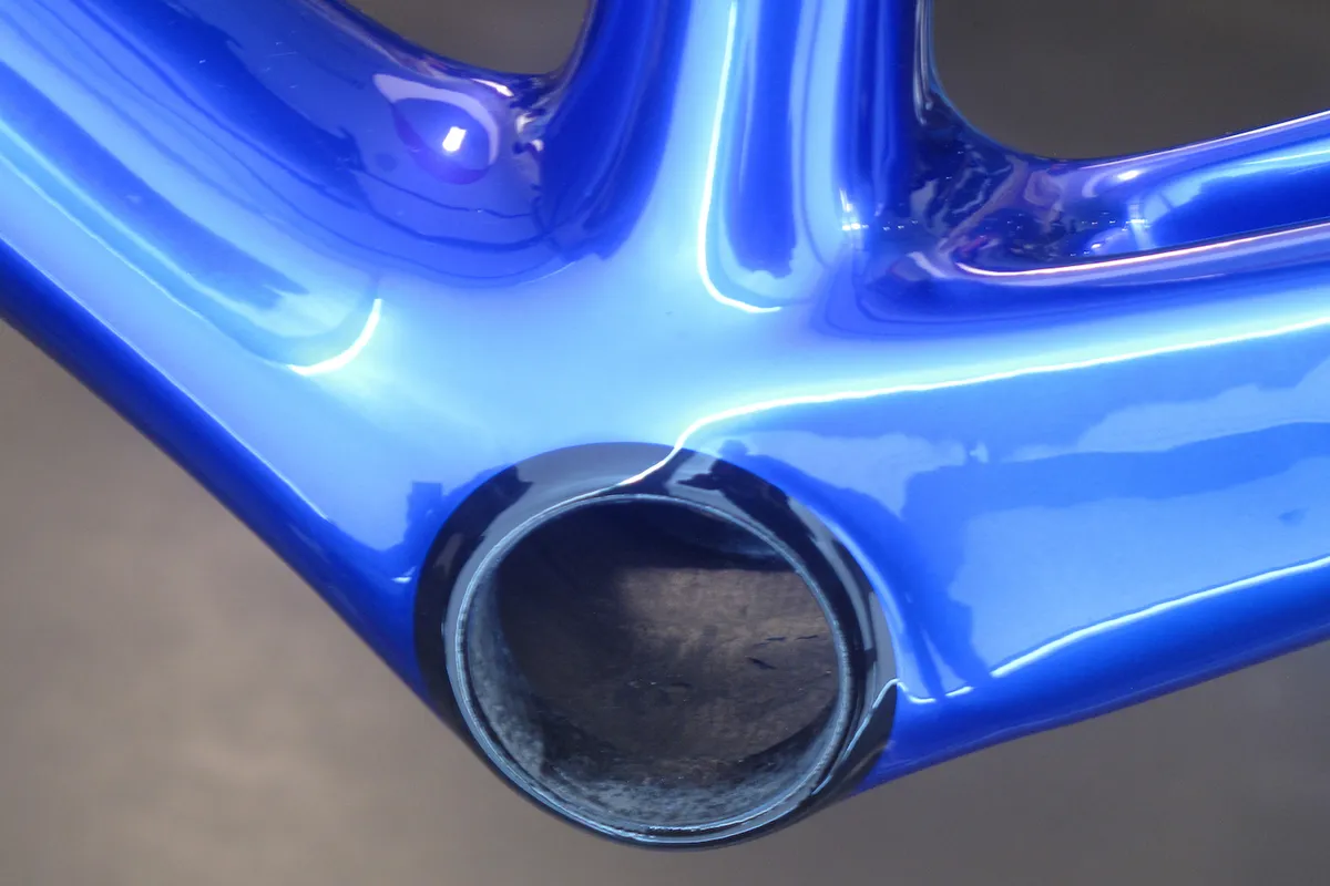 Bottom bracket shell on blue road bike frame