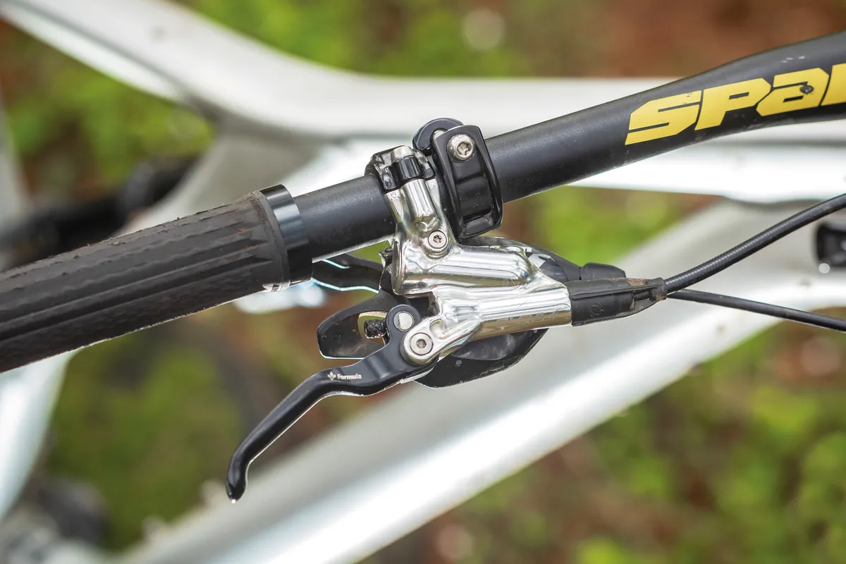 Silver disc brake lever on mountain bike