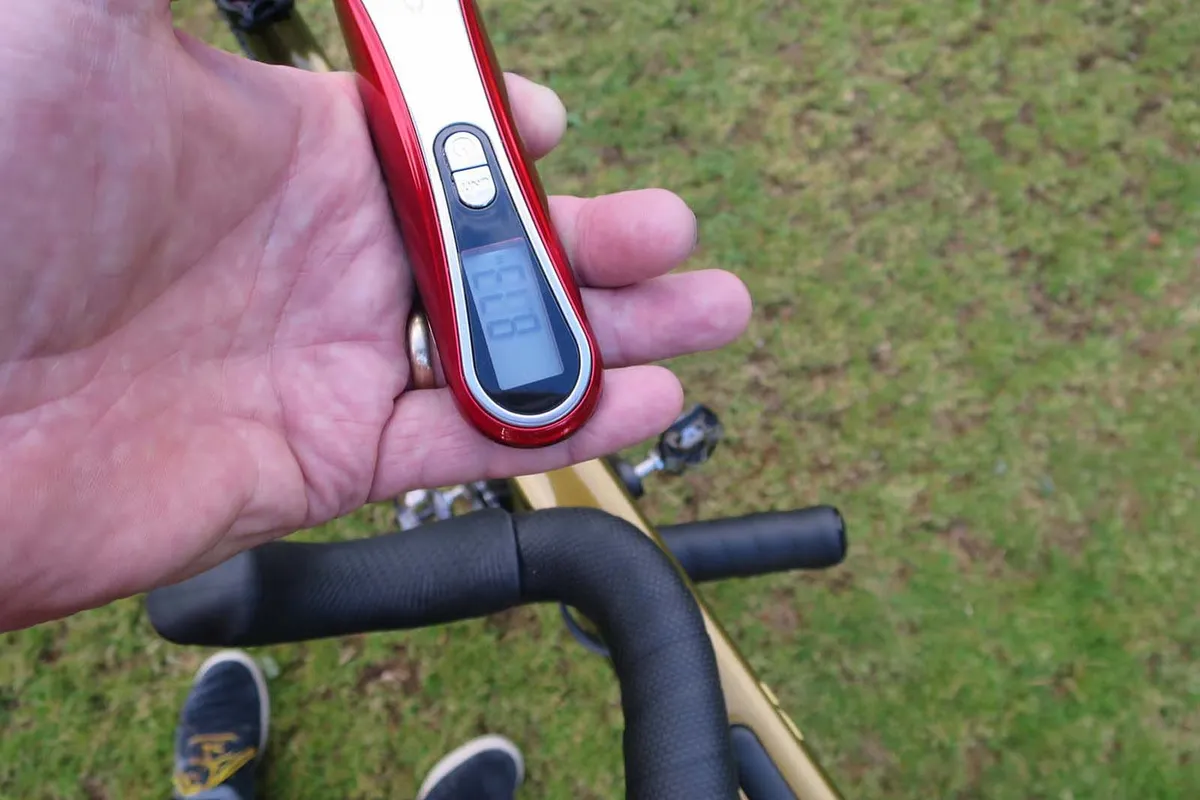 Scales showing weight of gravel bike