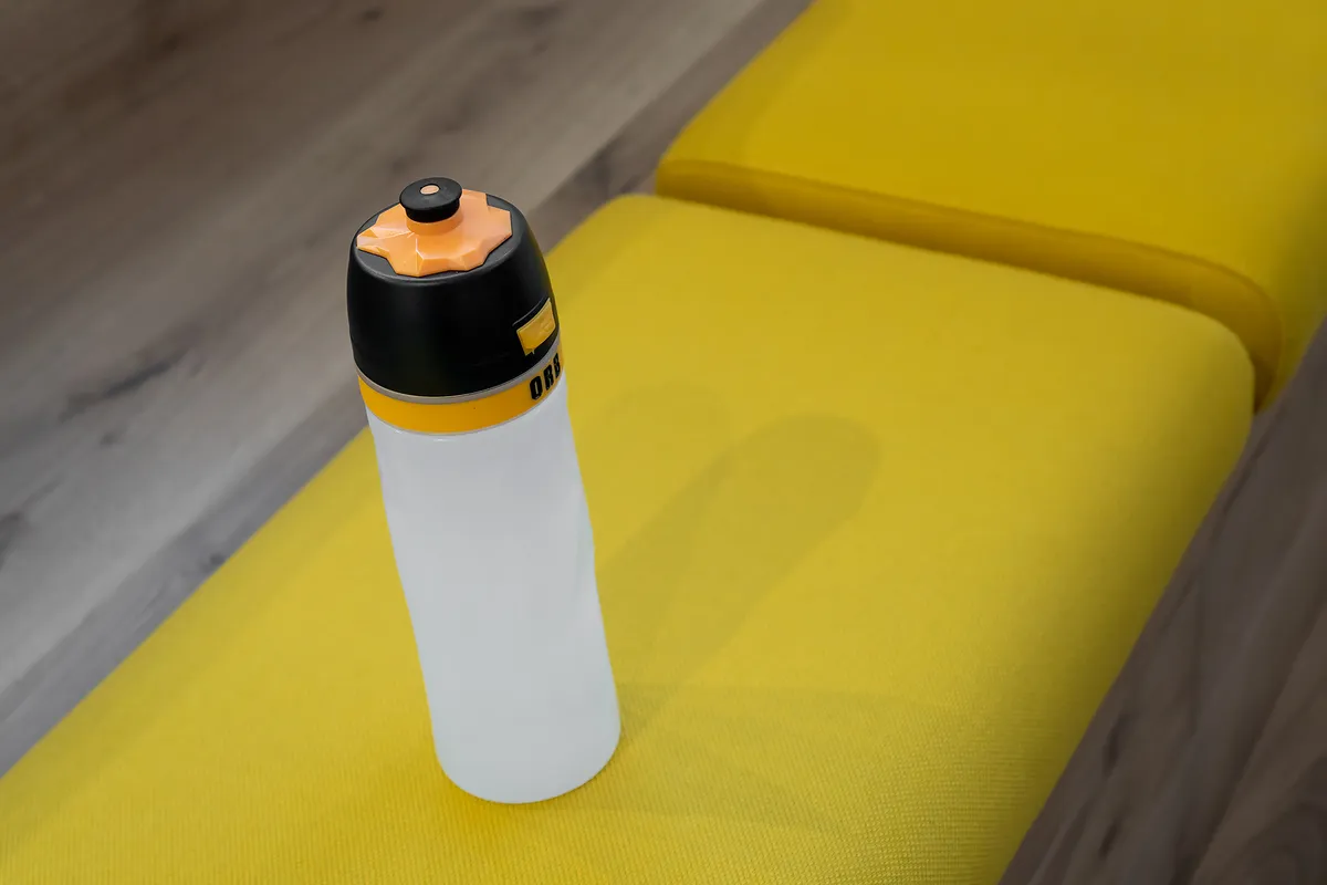 Orb light water bottle on yellow seat