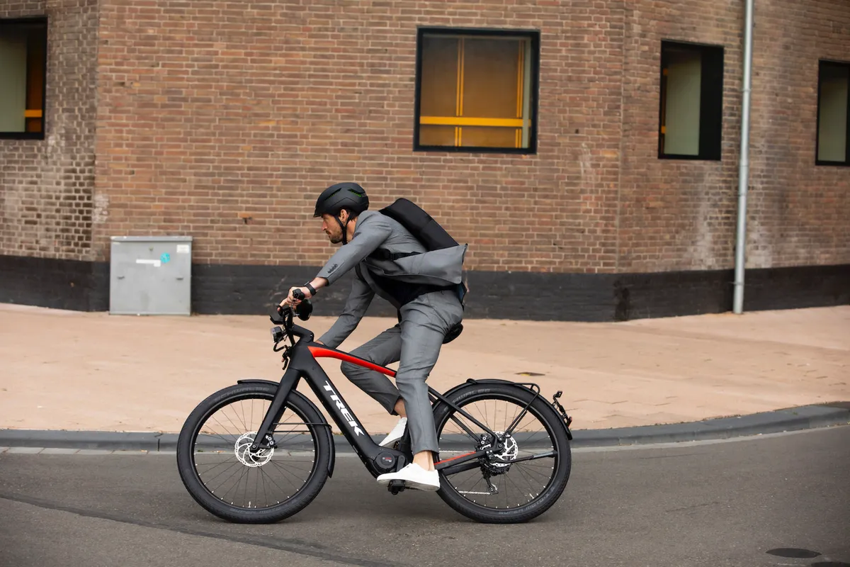 Trek Allant 9.9S being ridden by a man in a suit on the street