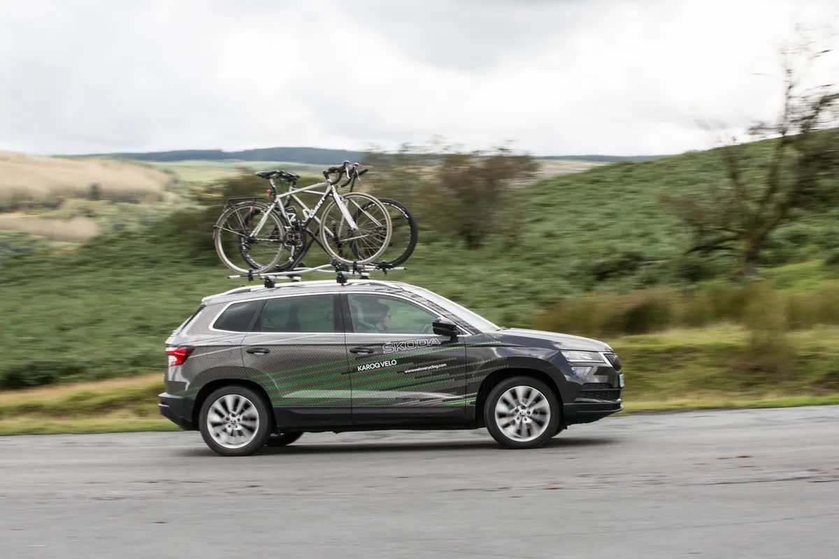 Skoda crossover with bikes on roof driving