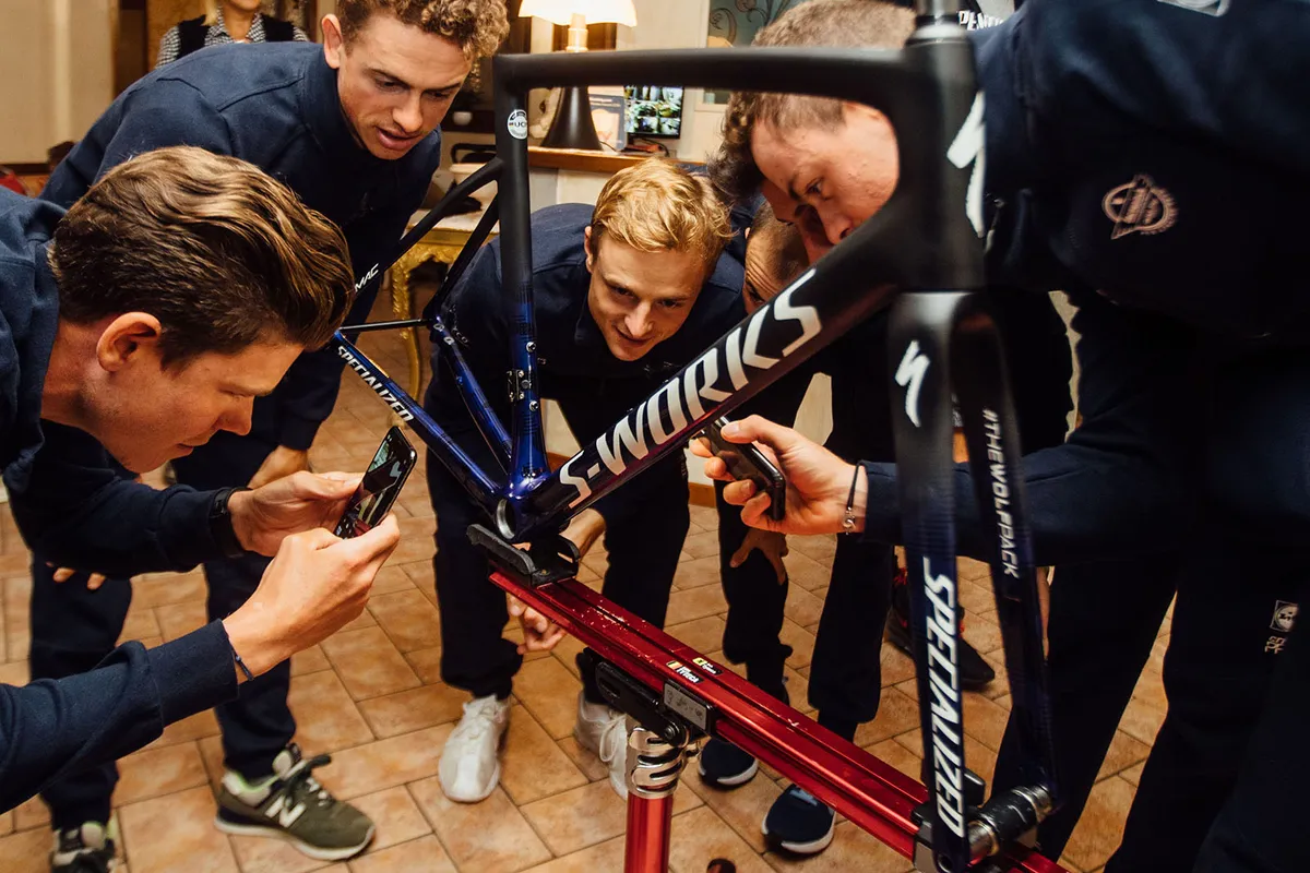 group of cyclists study the Specialized limited edition version of its S-Works Tarmac Disc frameset
