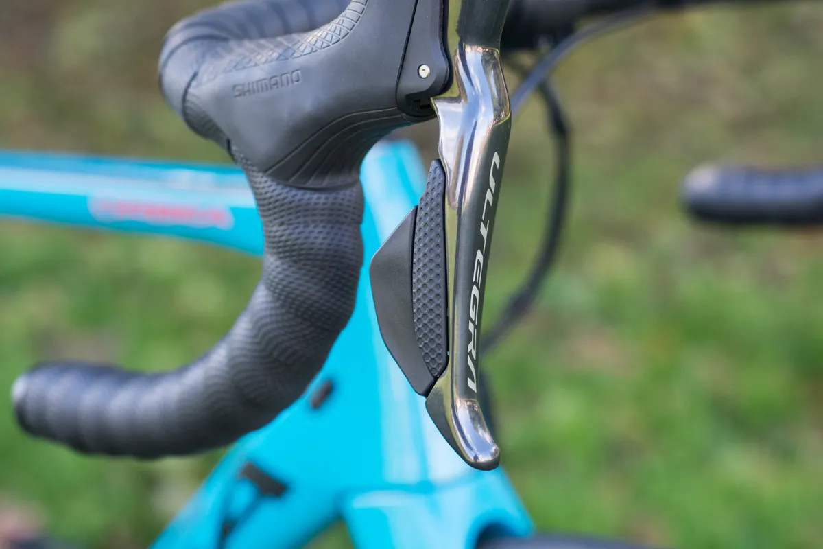 Close-up of Shimano Di2 lever showing buttons.