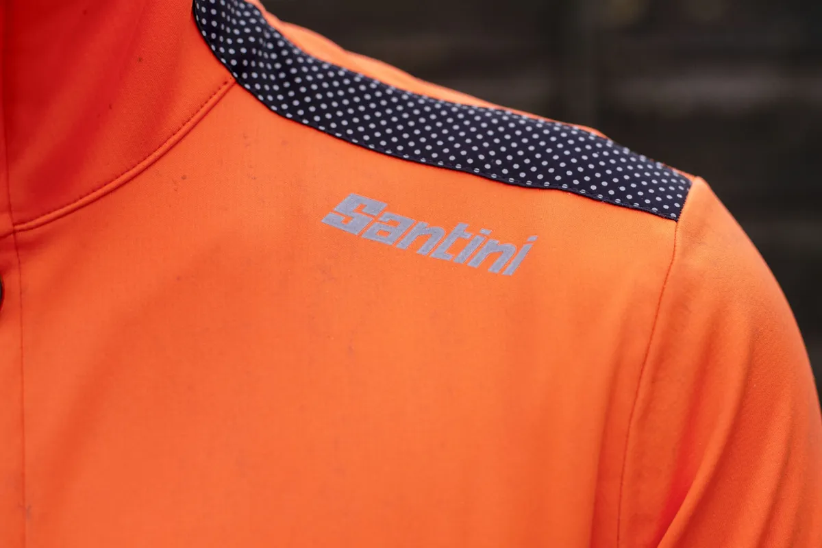 Santini Multi Vega jacket orange shoulder reflective patch