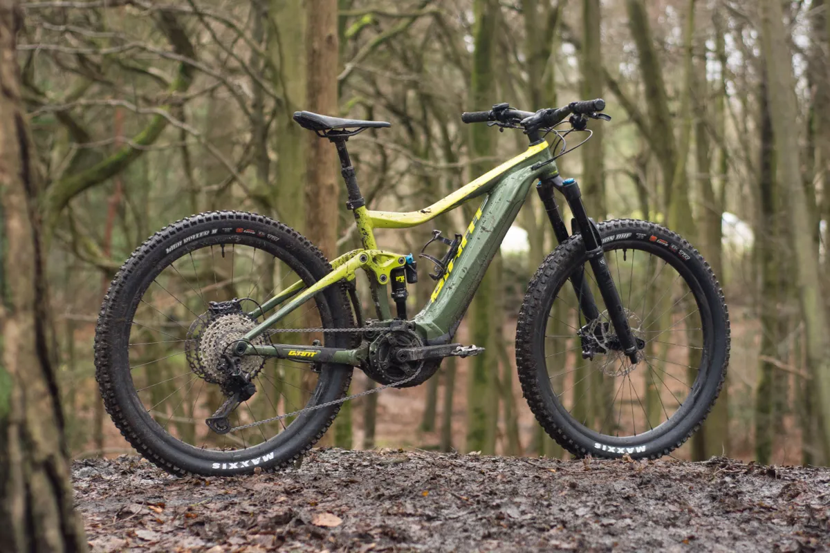 Yellow and green e-MTB in forest