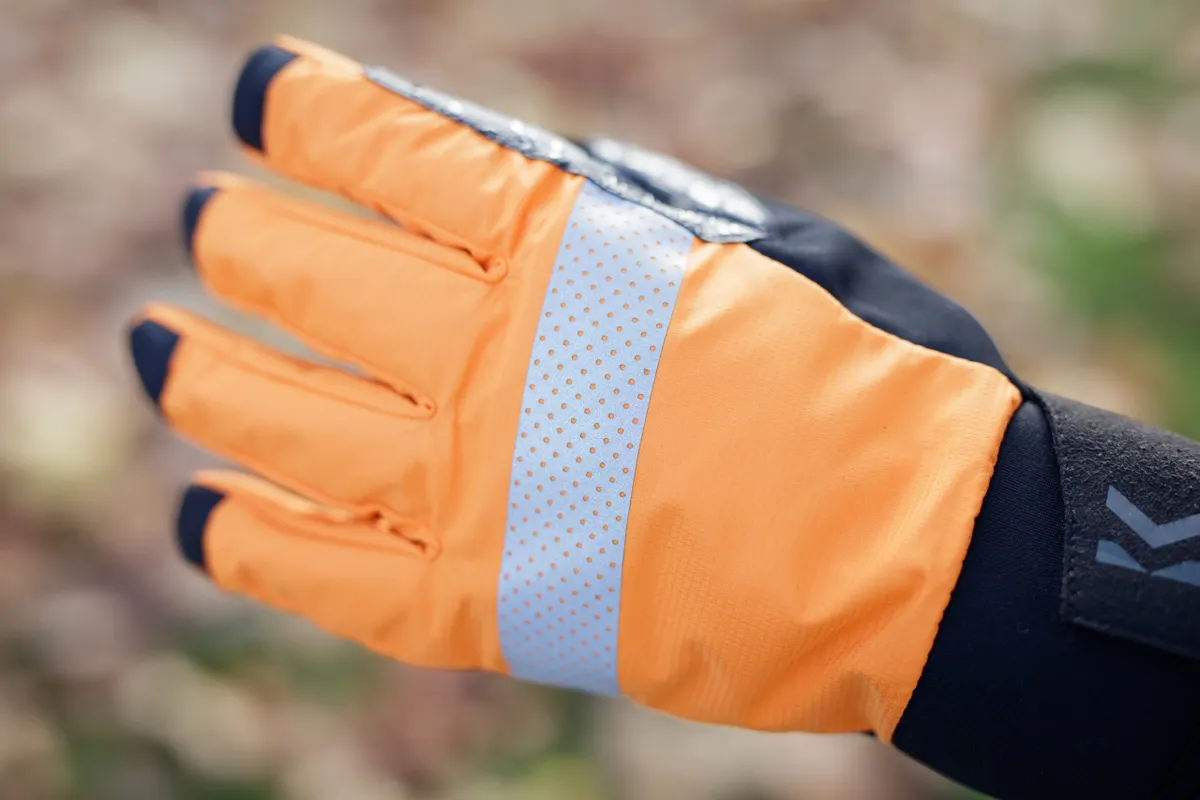 Orange back of glove with reflective strip
