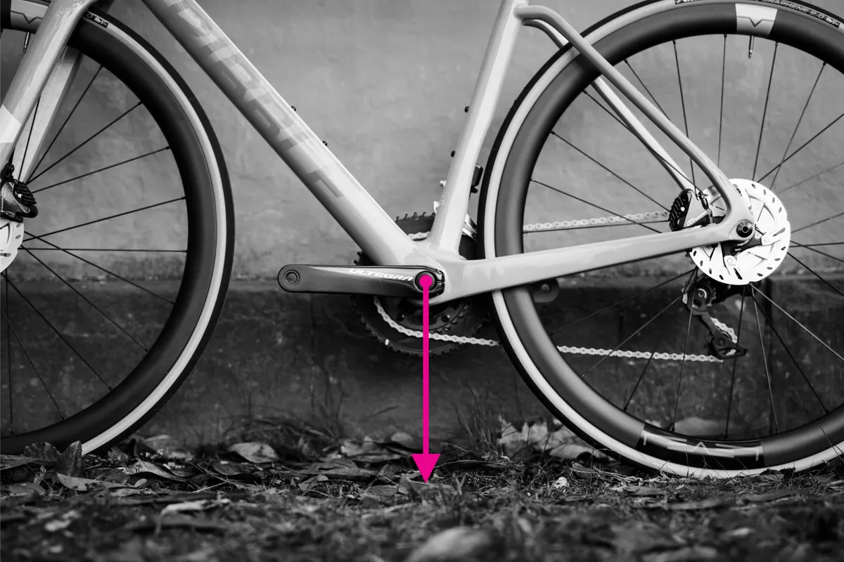 Bottom bracket height measurement demonstrated on bike frame