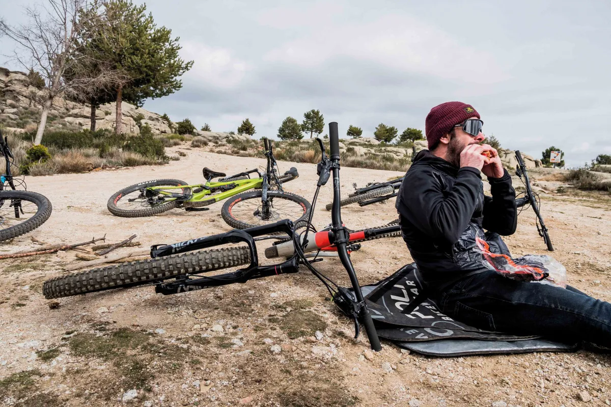 Robin Weaver eating a sandwich during a break from testing Bike of the Year 2020