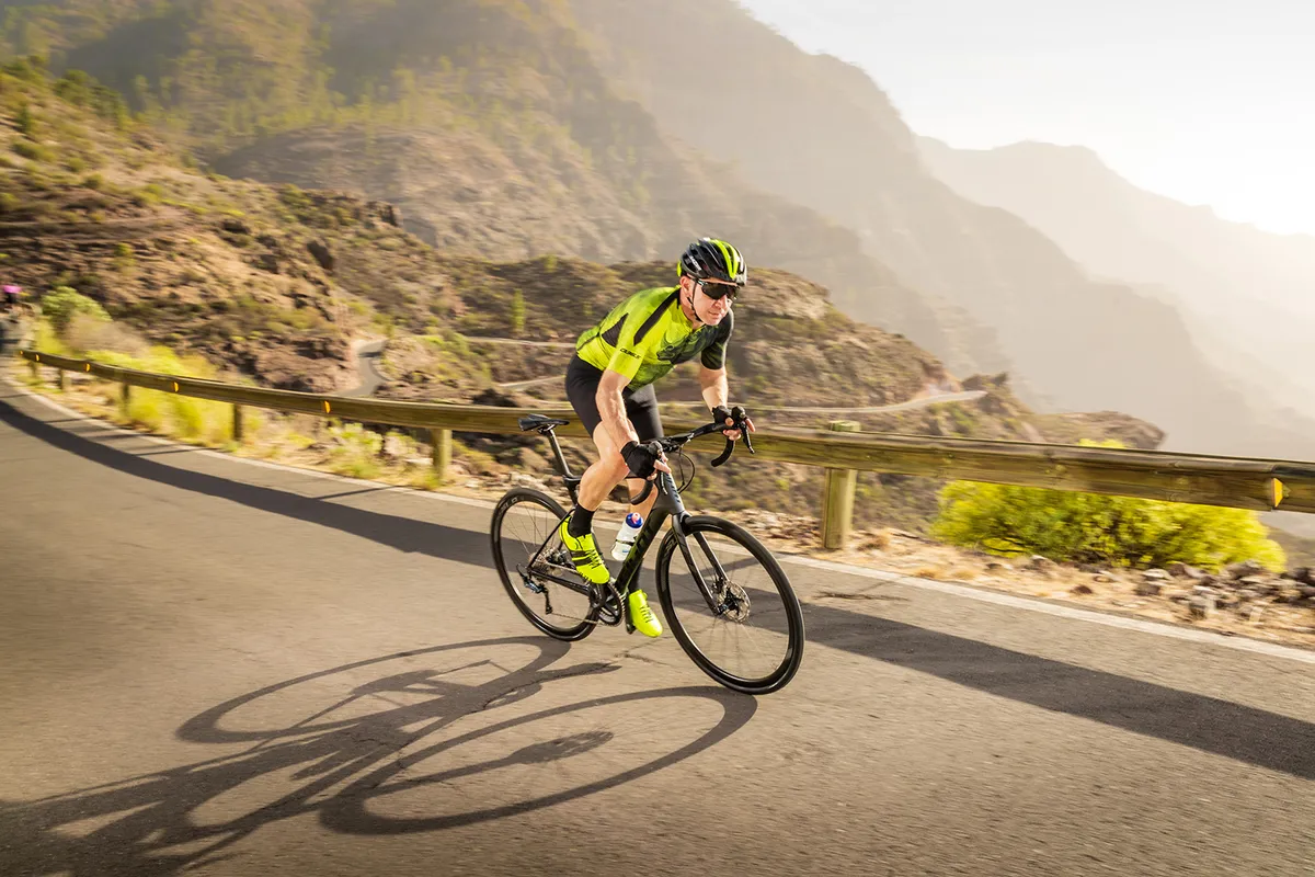 Cyclist riding Giant Defy Advanced Pro 2 through Spanish mountains