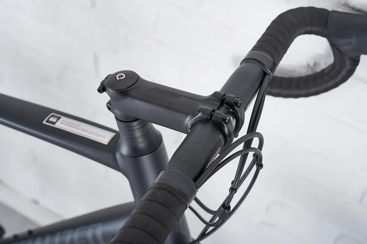 Specialized alloy stem and shallow-drop bar on road bike