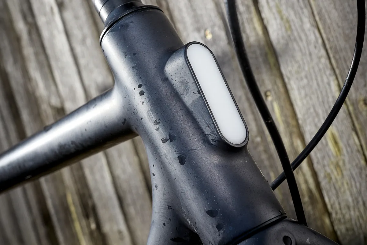 An integrated front light in the head tube of the Cowboy electric bike