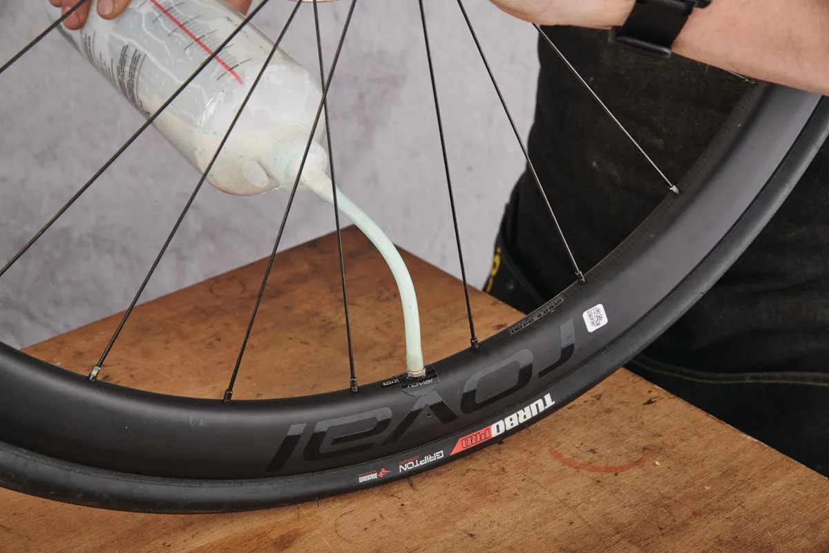 Adding sealant to a tubeless tyre