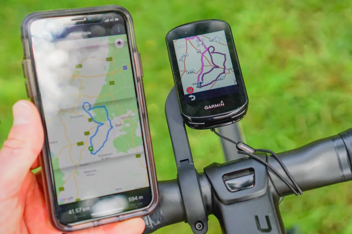 Garmin Edge 830 GPS bike computer with on-device mapping connected to an iPhone with Garmin Connect app showing a selected route
