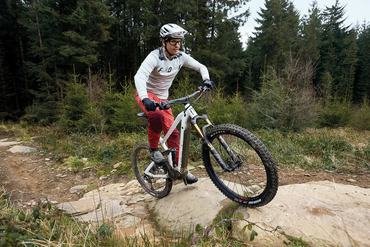 Male cyclist riding a full suspension eMTB