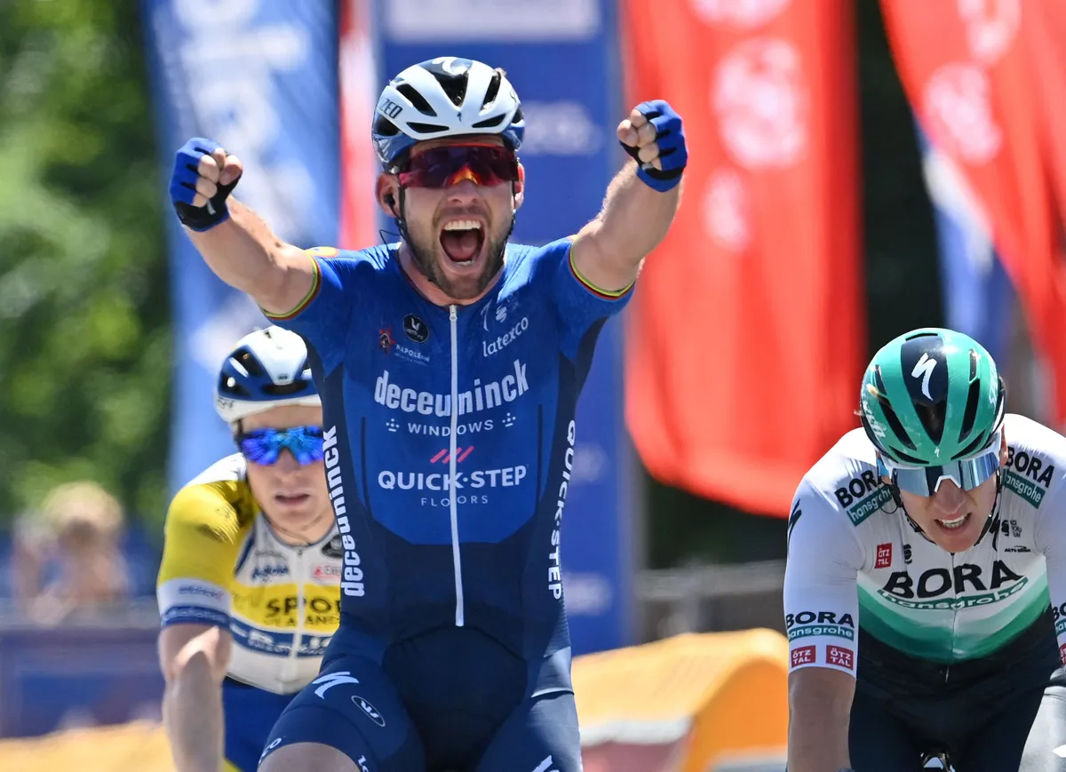 Deceuninck - Quick-Step'S British Mark Cavendish (C) celebrates as he crosses the finish line to win the fifth and last stage of the Baloise Belgium Tour cycling race, a 178,7 km between Turnhout and Beringen, on June 13 2021. - Belgium OUT (Photo by DAVID STOCKMAN / various sources / AFP) / Belgium OUT (Photo by DAVID STOCKMAN/Belga/AFP via Getty Images)