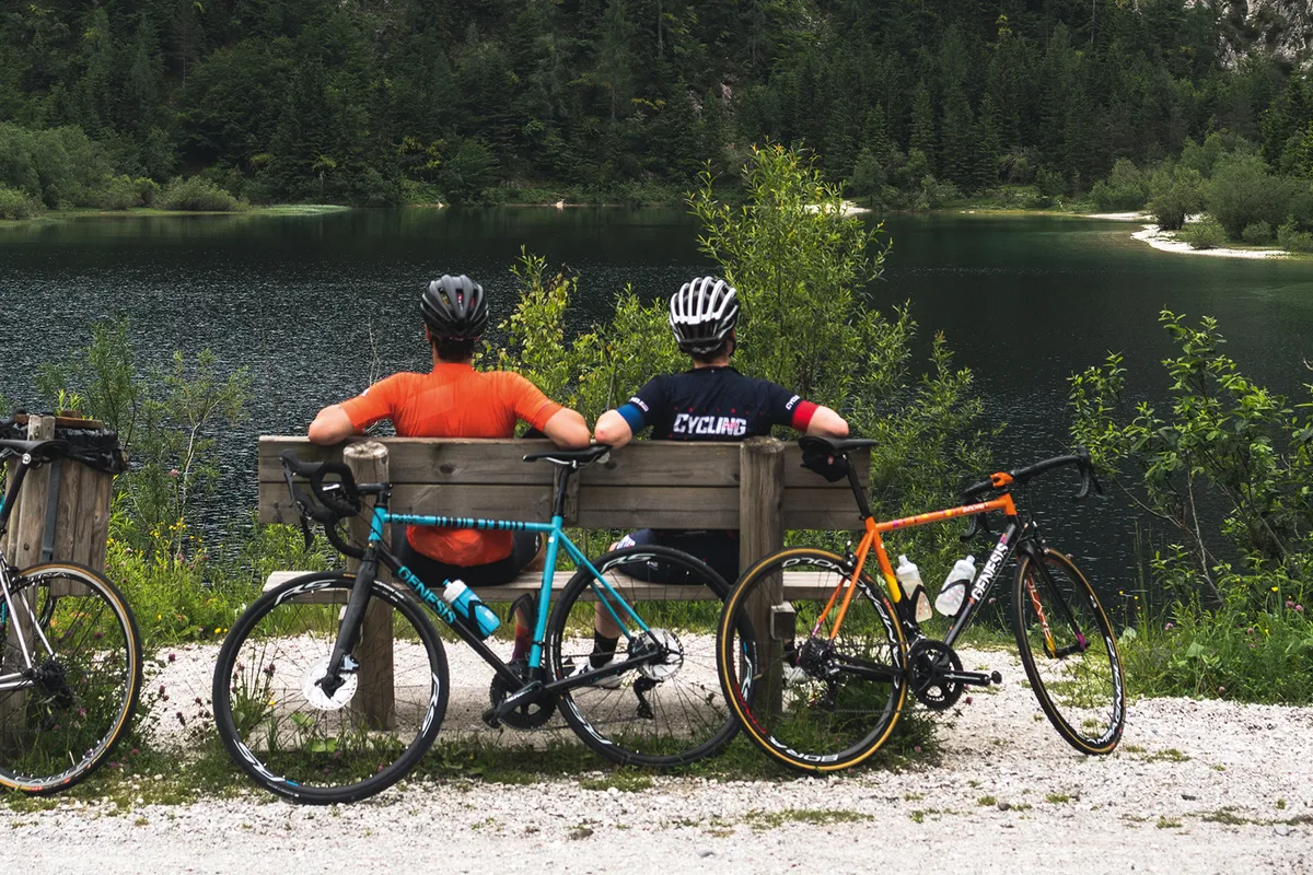 Male cyclists taking a well rest and enjoying the view in Slovenia