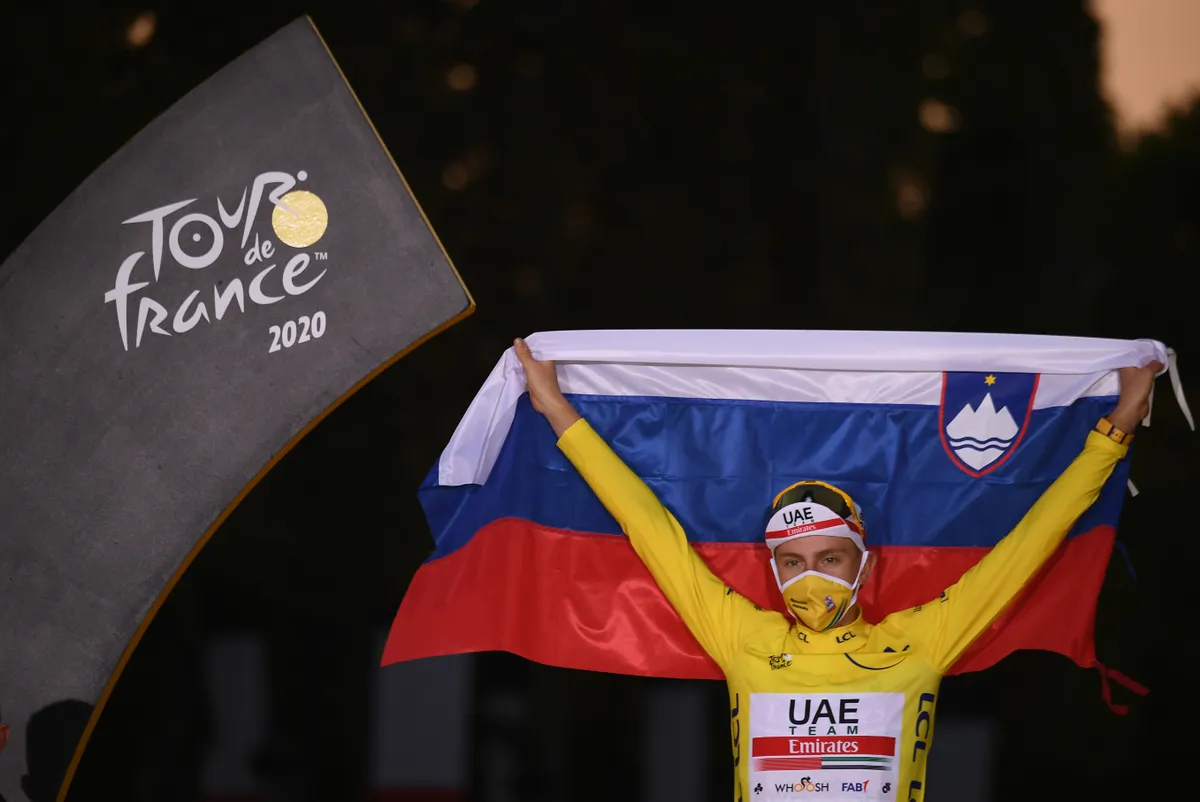 Team UAE Emirates rider Slovenia's Tadej Pogacar wearing the overall leader's yellow jersey celebrates on the podium after winning the 107th edition of the Tour de France cycling race, after the 21st and last stage of 122 km between Mantes-la-Jolie and Champs Elysees Paris, on September 20, 2020. (Photo by Marco Bertorello / AFP) (Photo by MARCO BERTORELLO/AFP via Getty Images)