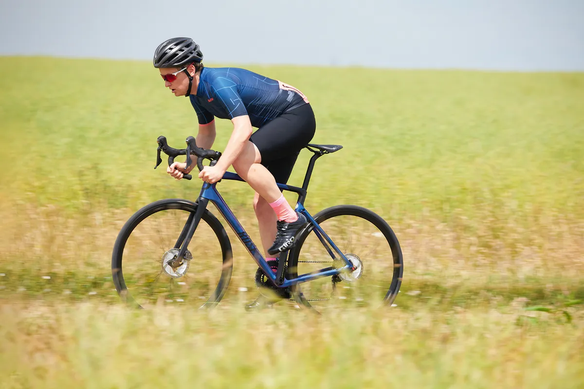 Male cyclist in blue riding the Rose Reveal Four Disc Ultegra bike
