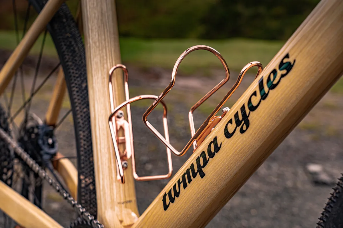 Metal bottle cages mounted to frame