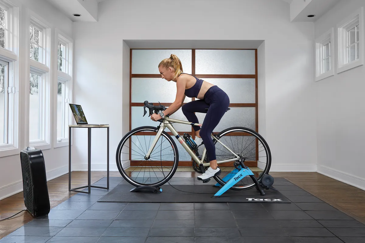Woman riding the Tacx Boost turbo trainer