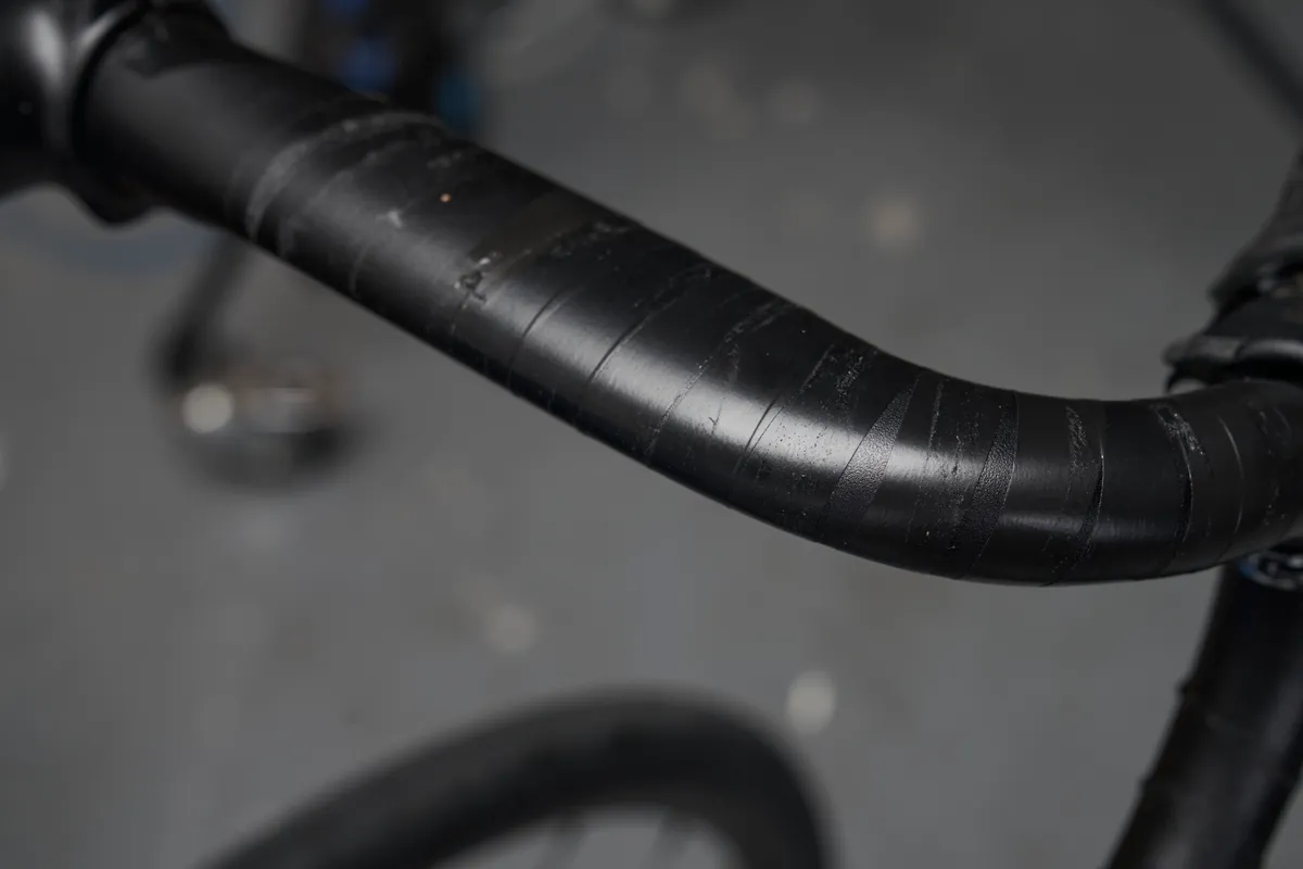 Electrical tape securing housing on handlebar.