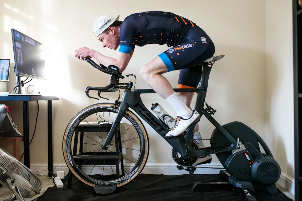 Simon Bromley riding a time trial bike on a smart trainer