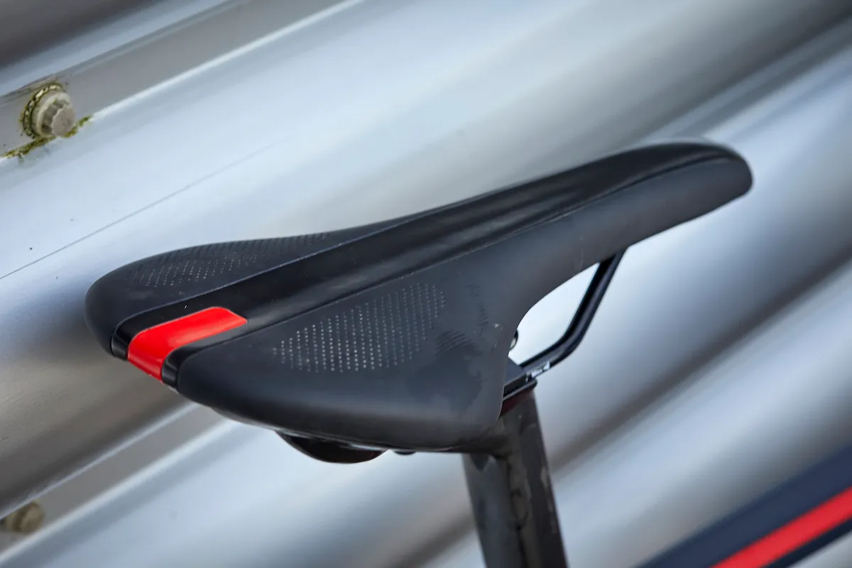 The BMC Teammachine ALR Disc Two road bike is equipped with a Velo VL-1489 saddle on a BMC carbon D-shape post