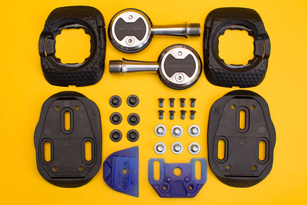 Contents of Wahoo Speedplay Zero box including pedals, cleats, adaptors and mounting hardware