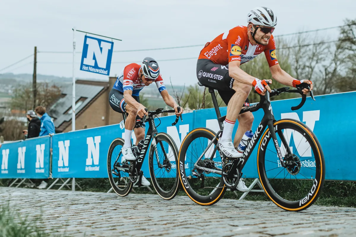 Kasper Asgreen and Mathieu van der Poel riding a cobbled climb