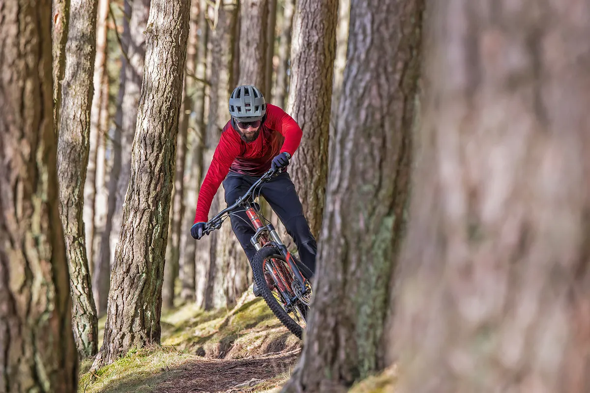 Male cyclist in red top riding the Carrera Fury hardtail mountain bike 