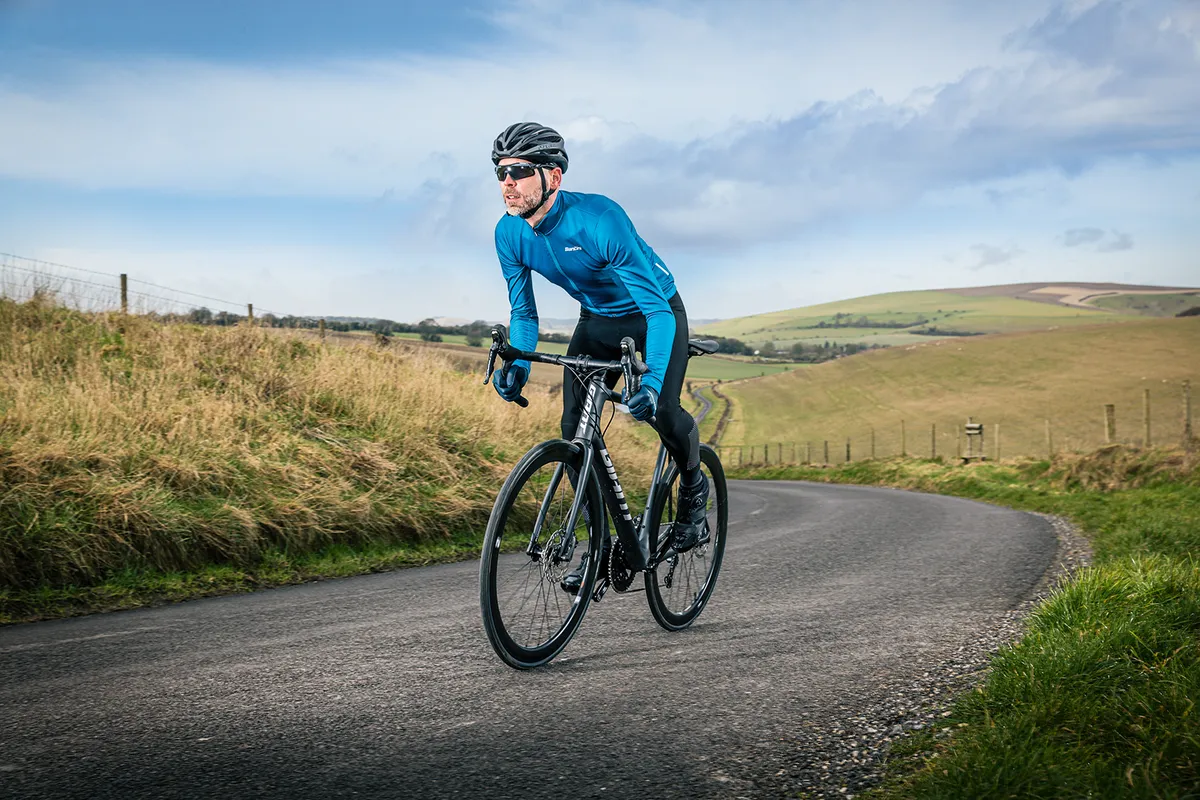 Cyclist in blue riding the Giant TCR Advanced 1  Disc road bike