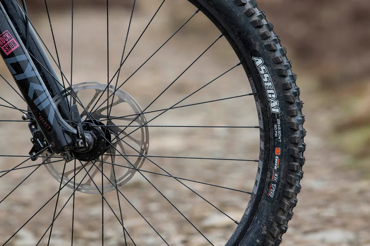 The Kona Process 153 DL 29 full suspension mountain bike is equipped with a Maxxis Assegai tyre up front