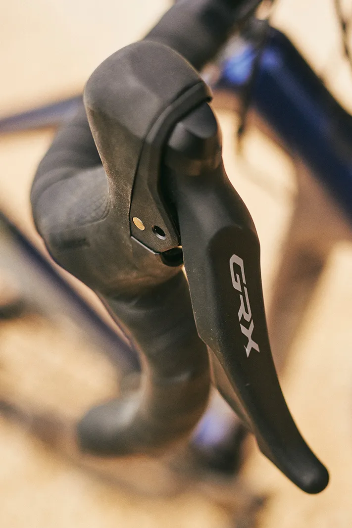 The Salsa Warbird Carbon GRX 600 road/gravel bike is equipped with Shimano GRX shifters
