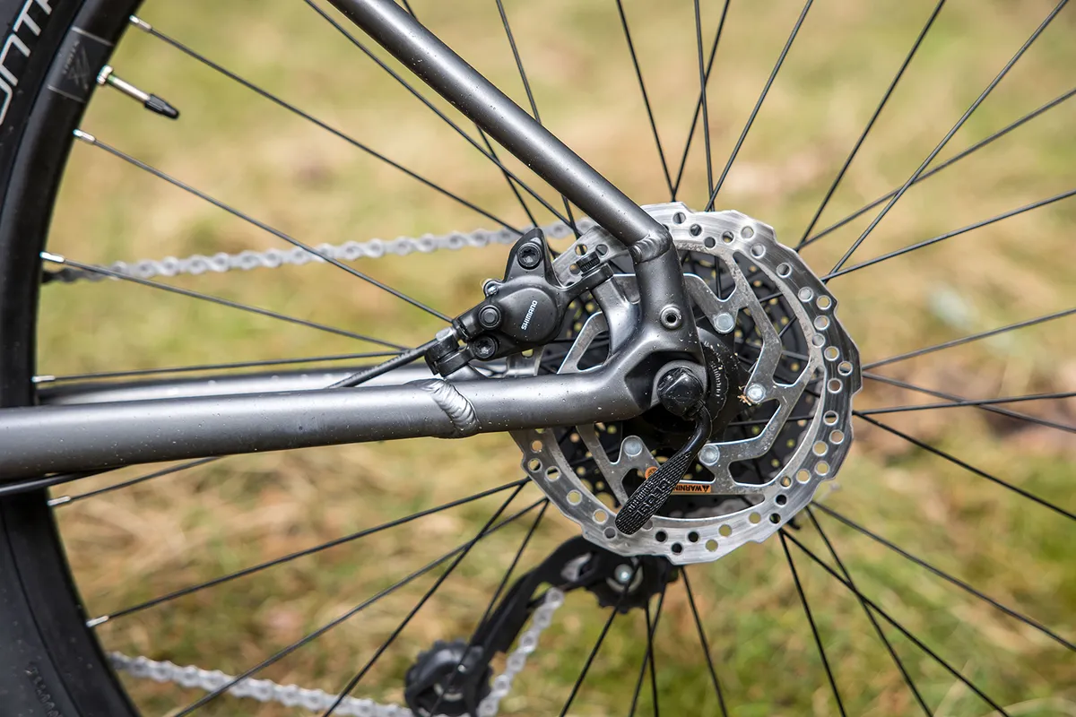 The Specialized Rockhopper Comp hardtail mountain bike has Shimano brakes