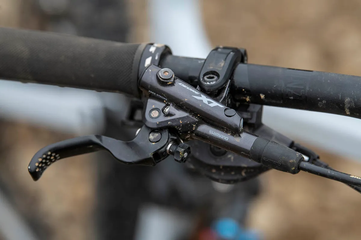 The Vitus Sommet CRX 29 full suspension mountain bike is equipped with Shimano XT brakes